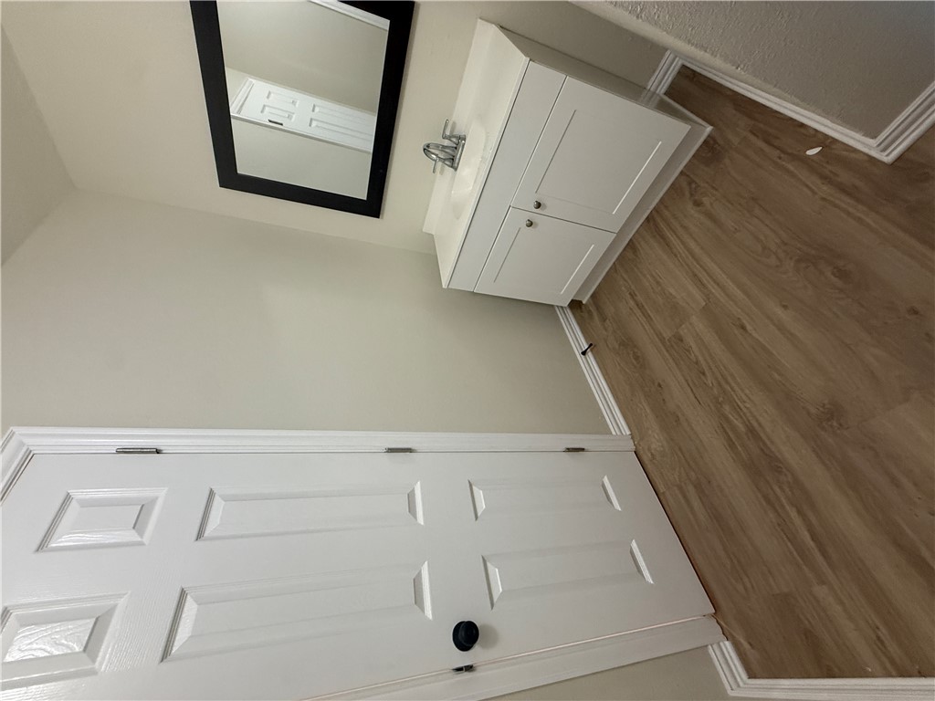 1613 Robeson Street Bryan, TX 77803 - Photo 12 of 18 a bathroom with a sink and a mirror