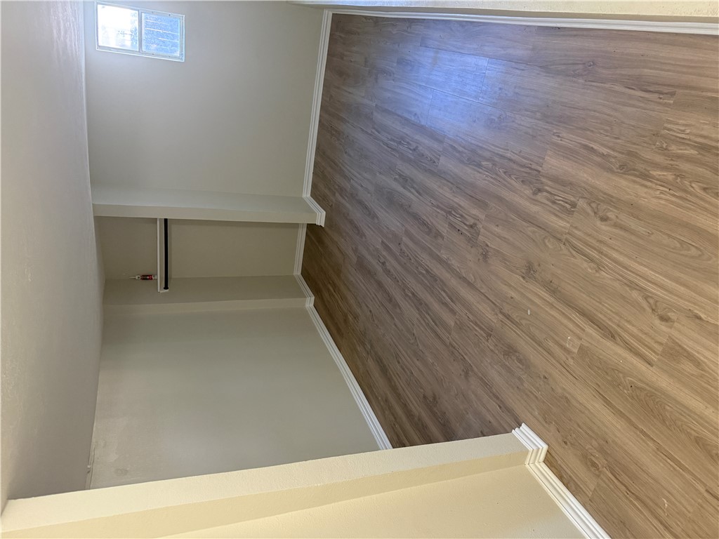 1613 Robeson Street Bryan, TX 77803 - Photo 16 of 18 an empty room with wooden floor and windows