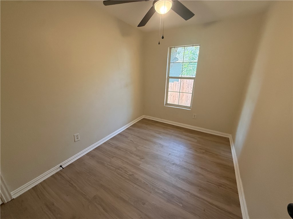 1613 Robeson Street Bryan, TX 77803 - Photo 10 of 18 an empty room with a window