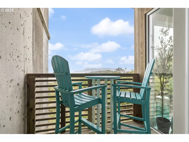 a view of a balcony with chairs