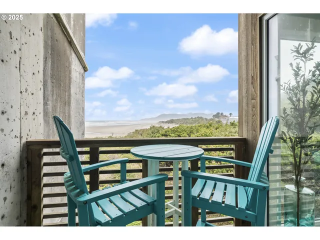 a view of a balcony with chairs