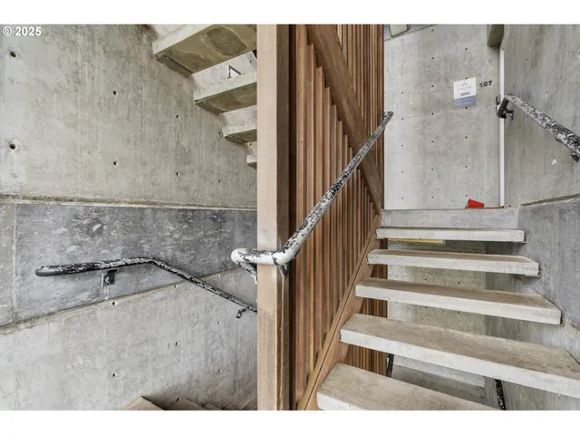 a view of staircase with white walls