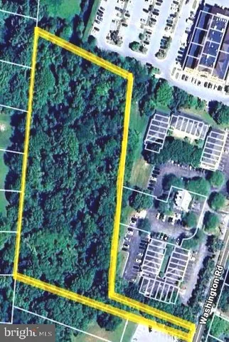 a view of swimming pool with lawn chairs and potted plants
