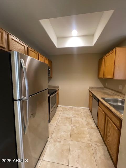 17032 North 16th Drive, Unit 4 Phoenix, AZ 85023 - Photo 4 of 9 a kitchen with stainless steel appliances a refrigerator and a sink