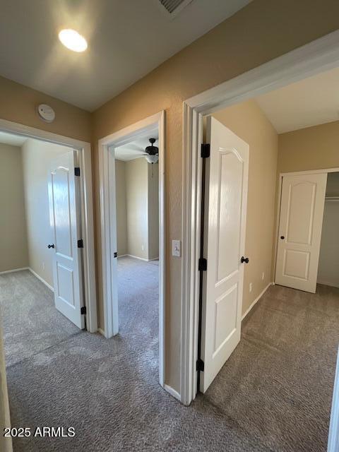 17032 North 16th Drive, Unit 4 Phoenix, AZ 85023 - Photo 5 of 9 a view of a hallway with wooden shelves