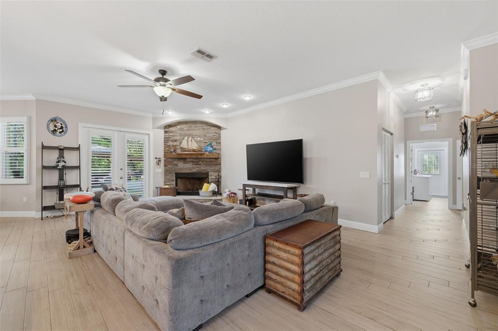 14582 Boland Avenue Spring Hill, FL 34610 - Photo 11 of 74 a living room with furniture and a flat screen tv
