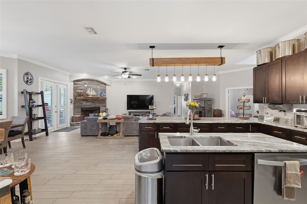 14582 Boland Avenue Spring Hill, FL 34610 - Photo 15 of 74 a kitchen with a sink and stove