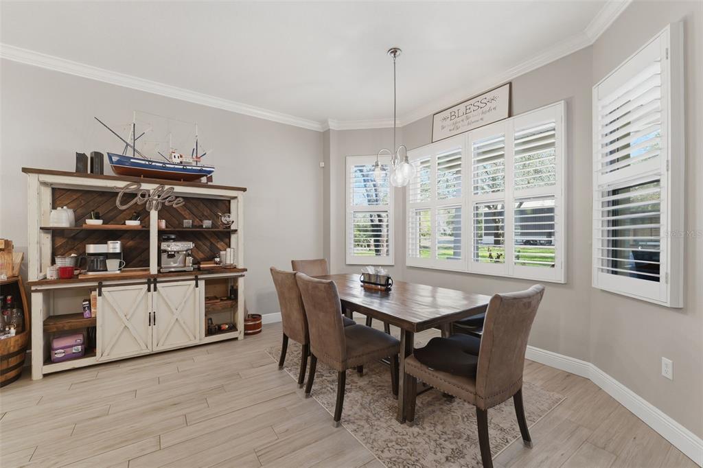 14582 Boland Avenue Spring Hill, FL 34610 - Photo 22 of 74 a dining room with furniture and window