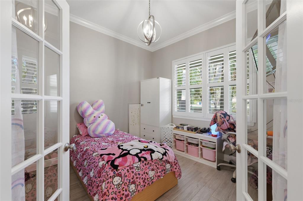 14582 Boland Avenue Spring Hill, FL 34610 - Photo 24 of 74 a bedroom with a bed and a window