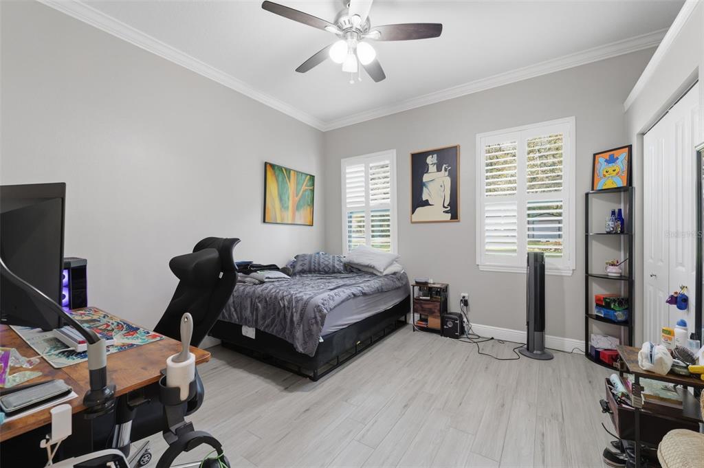 14582 Boland Avenue Spring Hill, FL 34610 - Photo 35 of 74 a bedroom with bed and a window