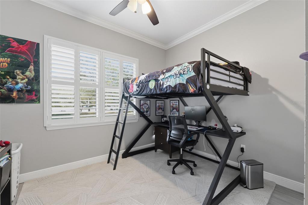 14582 Boland Avenue Spring Hill, FL 34610 - Photo 38 of 74 a view of a workspace with furniture and a window