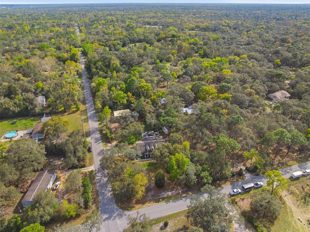 14582 Boland Avenue Spring Hill, FL 34610 - Photo 67 of 74 an aerial view of residential houses with outdoor space