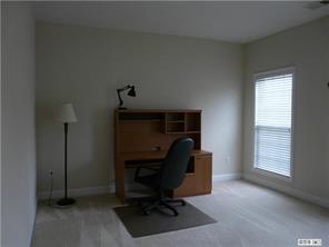 13617 Porter Creek Road Charlotte, NC 28262 - Photo 3 of 11 a view of a workspace with furniture and a window