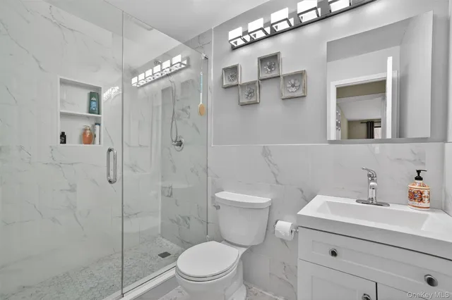 a kitchen with a refrigerator and a stove top oven
