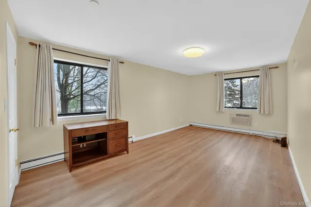 a view of a hallway with washer and dryer