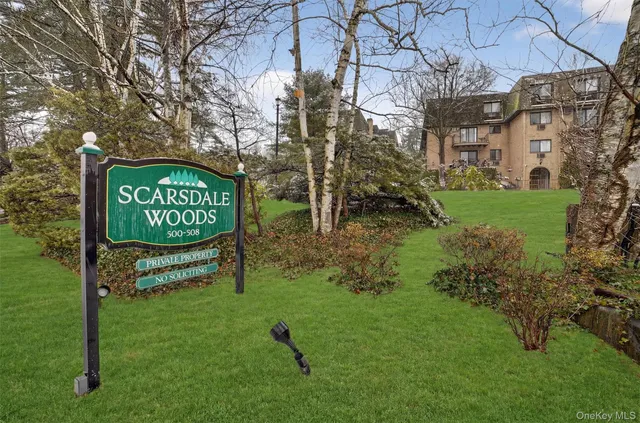 a view of a balcony with yard