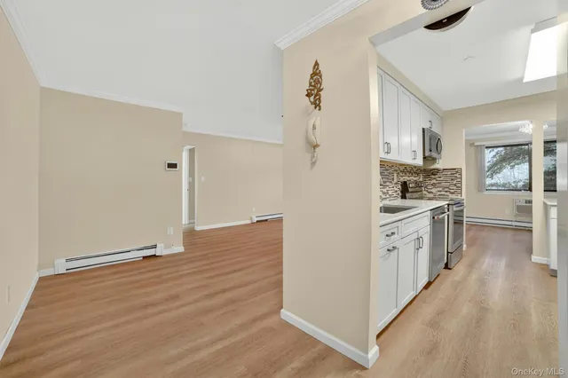a kitchen with granite countertop a refrigerator and a stove