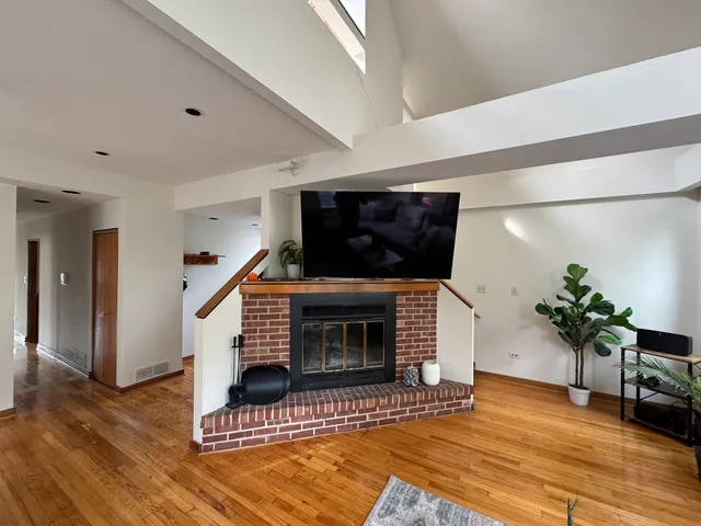 a bathroom with a sink a mirror a vanity and a shower