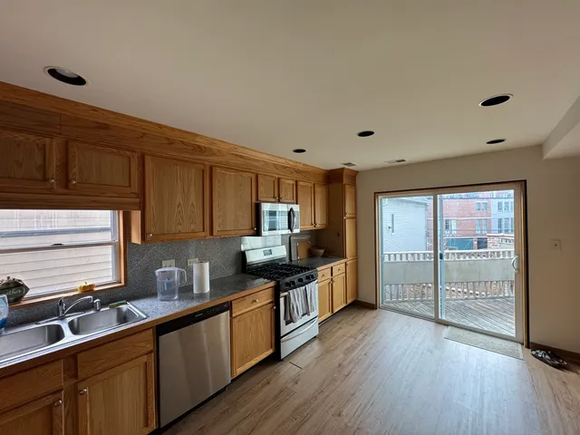 a view of a glass door with wooden floor