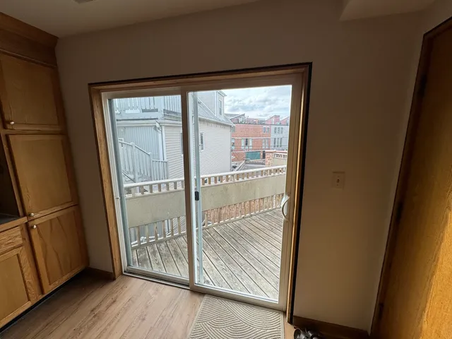 a living room with furniture and large windows