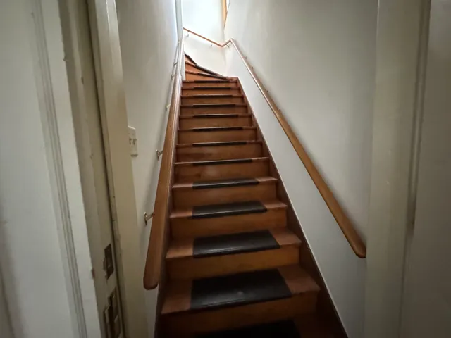 a view of a room with furniture and a window