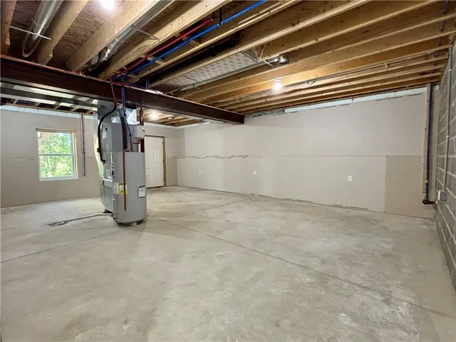 a view of empty room with wooden walls