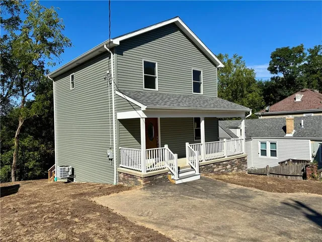 a front view of a house with a patio