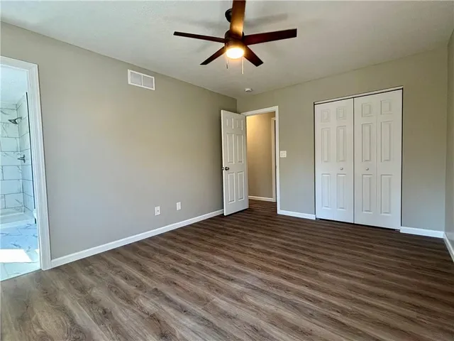 a bathroom with a shower and a toilet