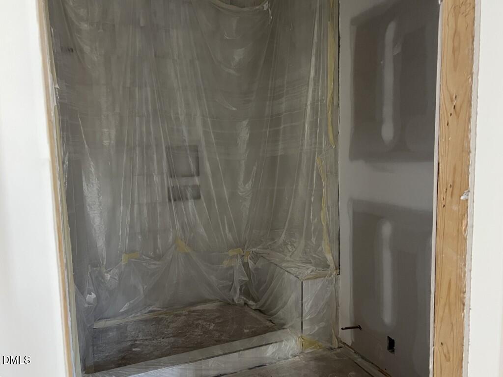 1001 Phoenix Place Raleigh, NC 27610 - Photo 11 of 13 a bathroom with a glass shower door