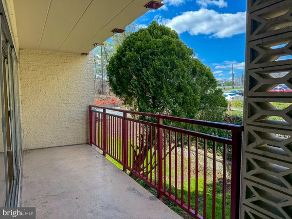a view of balcony with wooden floor