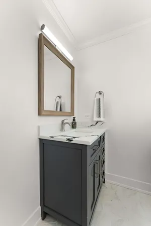 a bathroom with a sink a vanity and a mirror