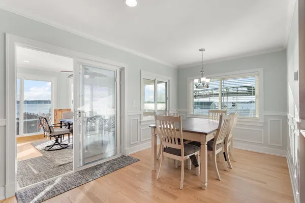 a view of a dining room with furniture wooden floor and a livingroom