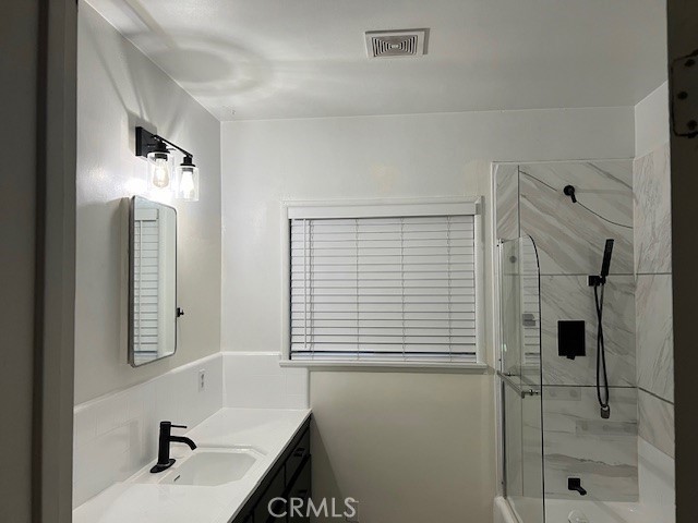 504 S Harbor Fullerton, CA 92832 - Photo 12 of 19 a bathroom with a sink a shower and a mirror