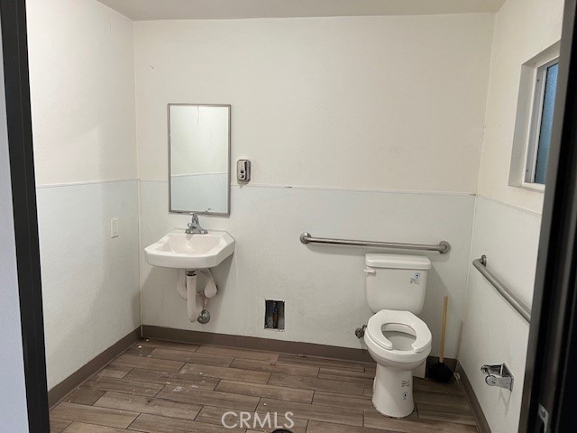 504 S Harbor Fullerton, CA 92832 - Photo 5 of 18 a bathroom with a sink toilet and a mirror