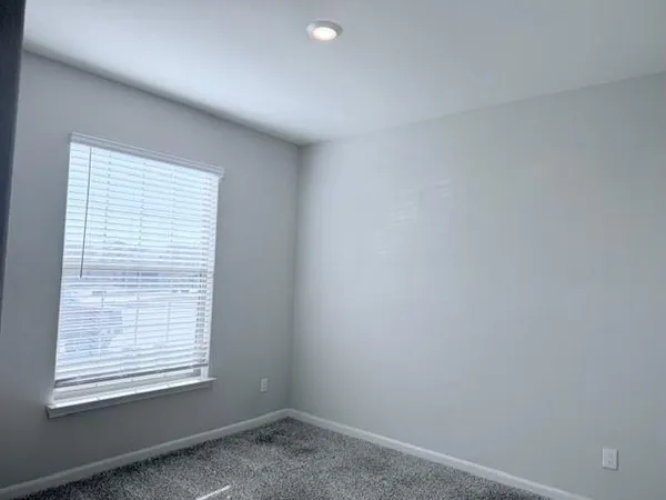 a view of a room that has a window in it