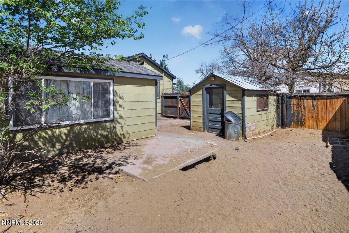 270 Vine Street Fernley, NV 89408 - Photo 12 of 28 a view of a house with a yard and garage