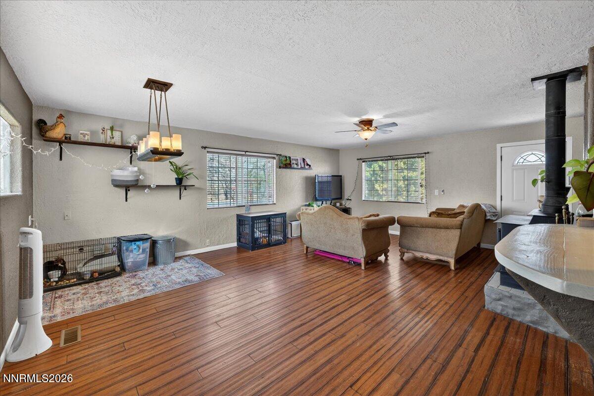 270 Vine Street Fernley, NV 89408 - Photo 17 of 28 a living room with furniture and a chandelier