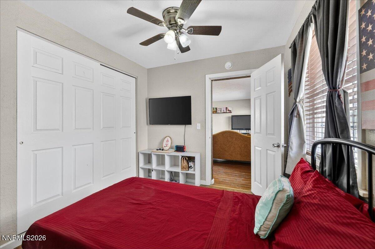 270 Vine Street Fernley, NV 89408 - Photo 23 of 28 a bedroom with a bed and a flat screen tv