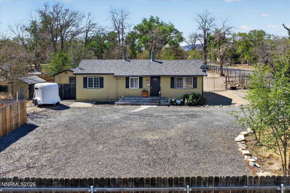 270 Vine Street Fernley, NV 89408 - Photo 4 of 28 a front view of a house with a garden