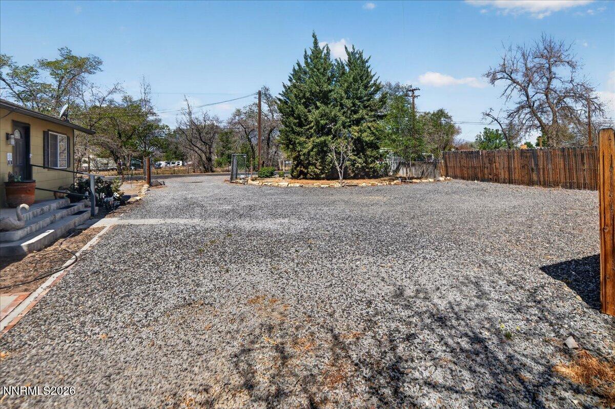 270 Vine Street Fernley, NV 89408 - Photo 6 of 28 a view of a yard with a tree