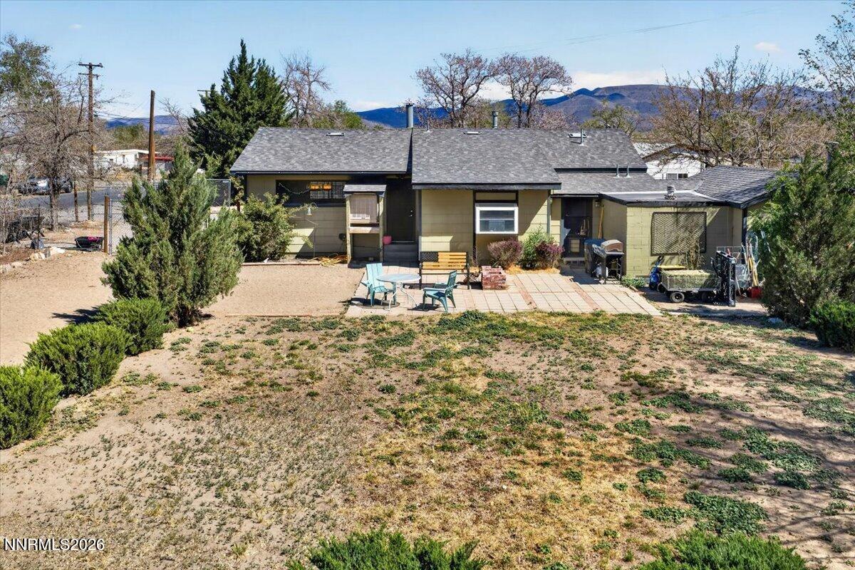 270 Vine Street Fernley, NV 89408 - Photo 8 of 28 a view of the house with backyard and furniture