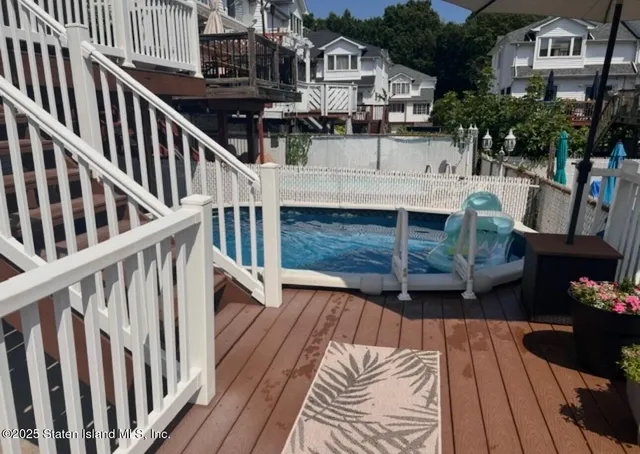 a view of a house with wooden porch