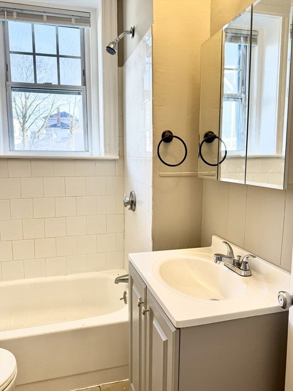 124 Green Street, Unit 206 Lynn, MA 01902 - Photo 7 of 7 a bathroom with a sink a toilet and a bathtub