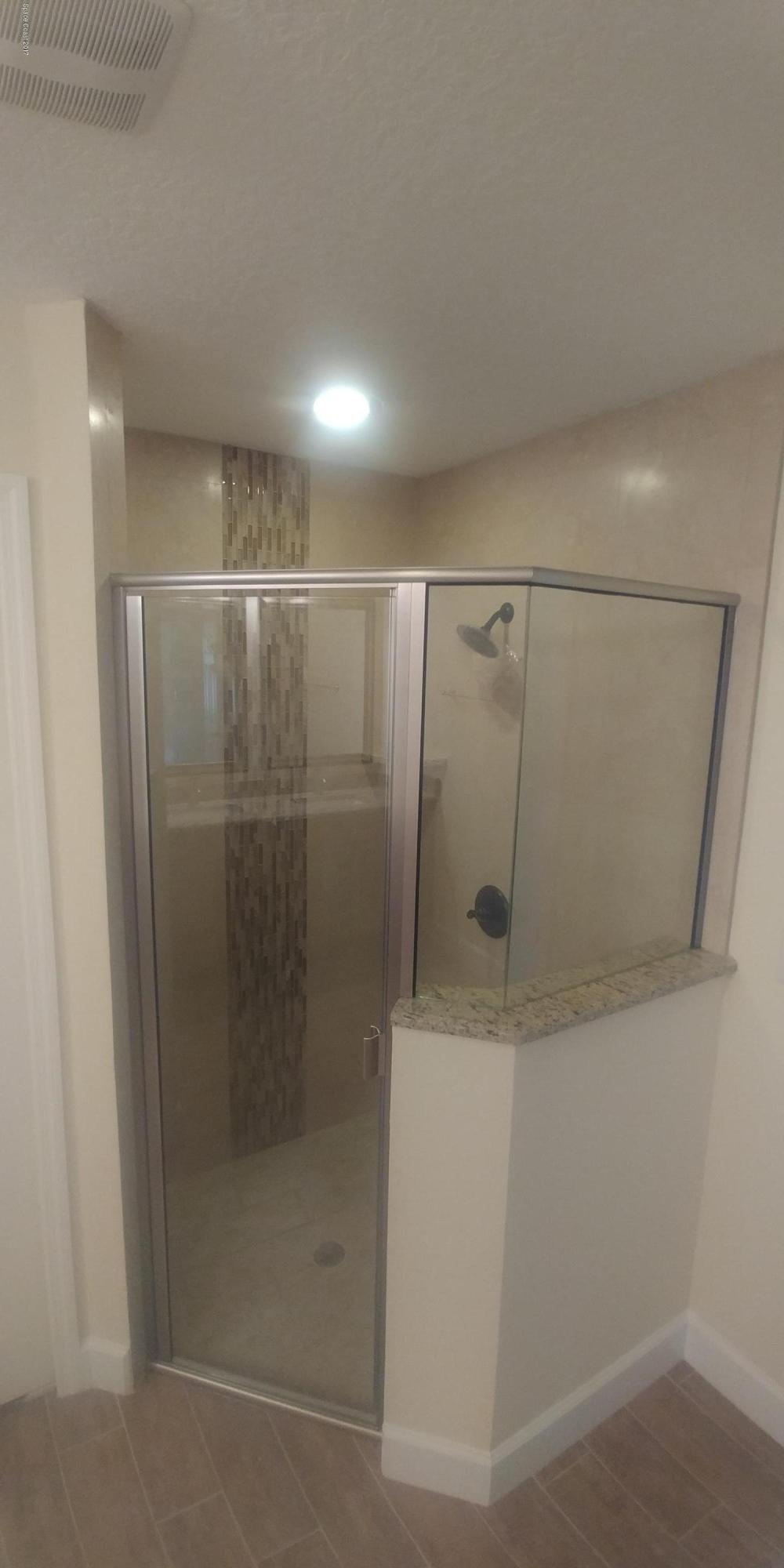 6105 Degan Road Cocoa, FL 32927 - Photo 14 of 21 a bathroom with a shower