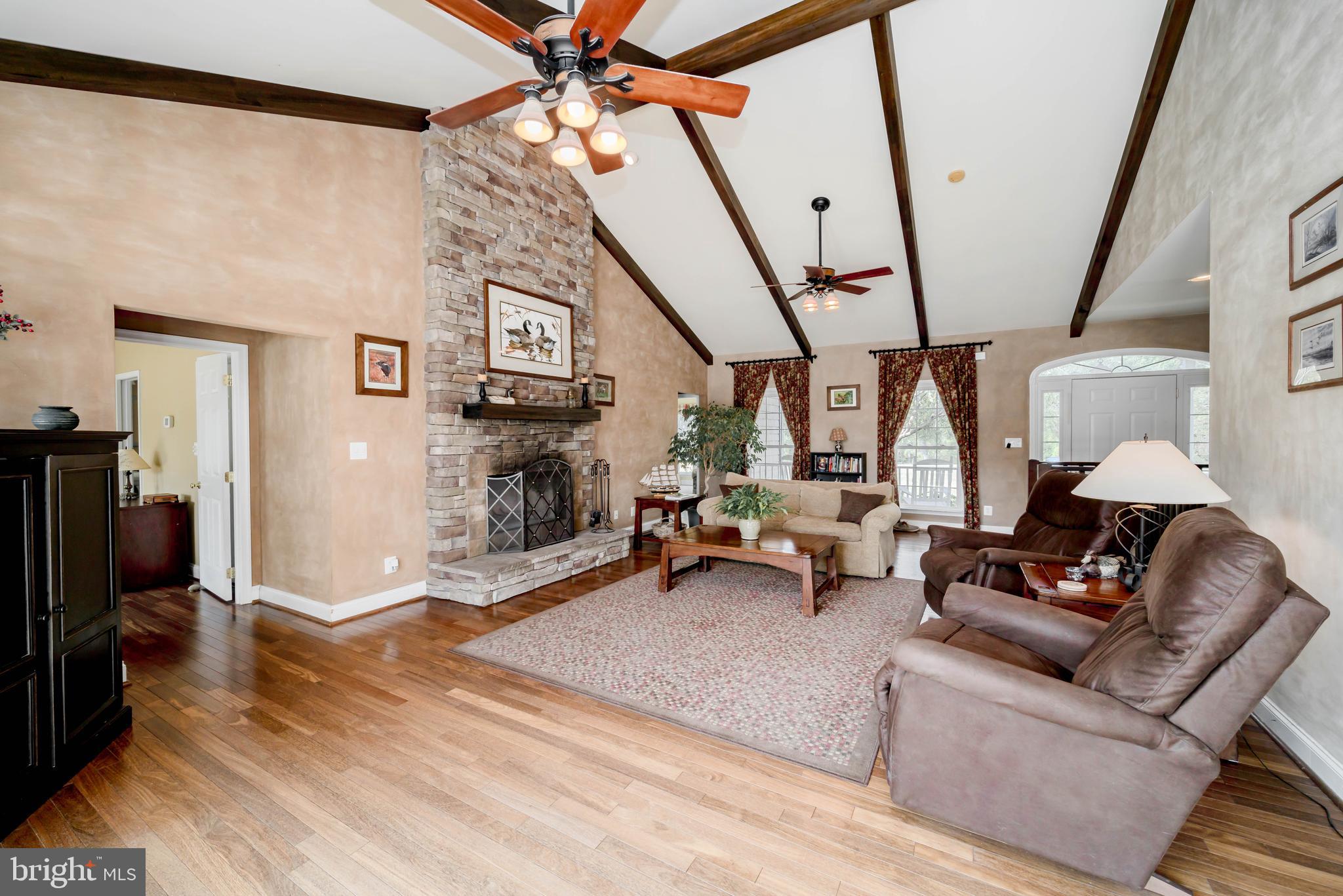 7295 Flint Hill Road Owings, MD 20736 - Photo 7 of 39 a living room with furniture and a flat screen tv