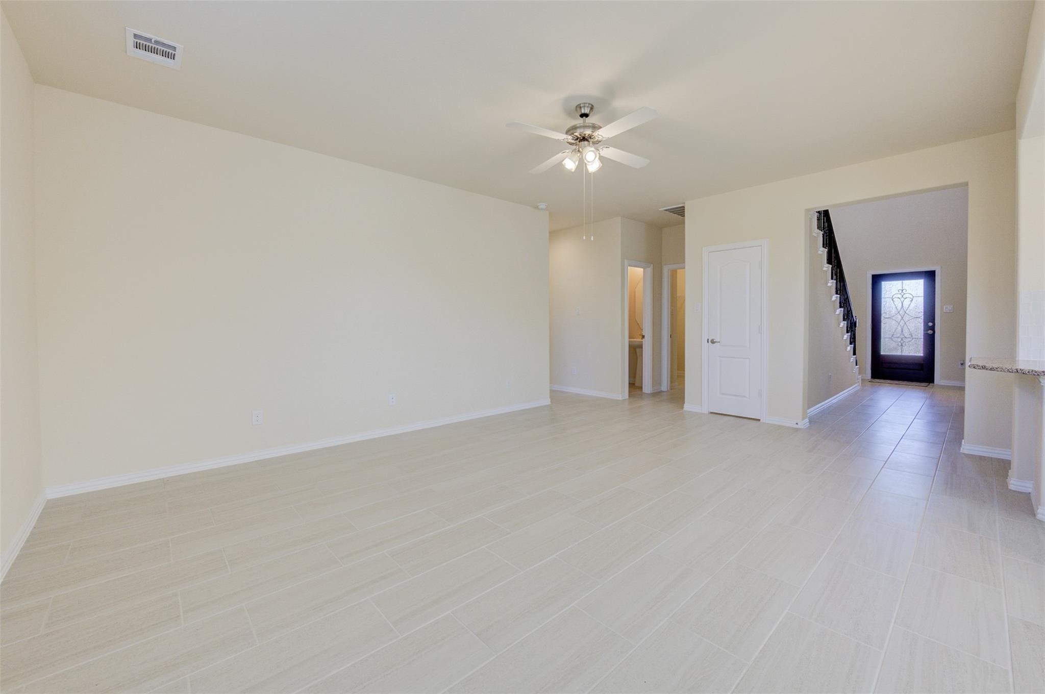 10902 Granite Chief Drive Rosharon, TX 77583 - Photo 14 of 32 a view of a livingroom with a ceiling fan and window