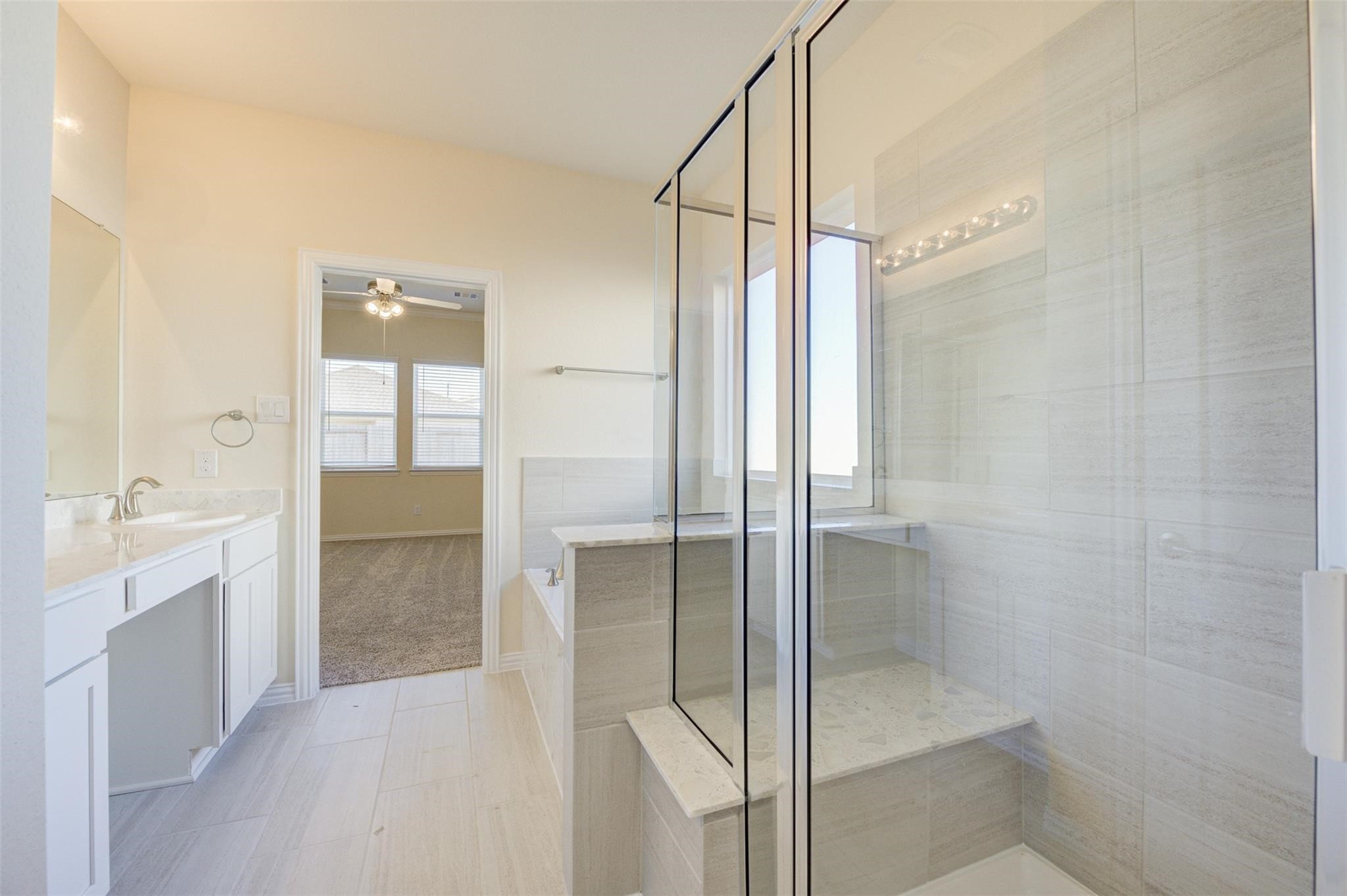 10902 Granite Chief Drive Rosharon, TX 77583 - Photo 20 of 32 a bathroom with a glass shower door and a sink