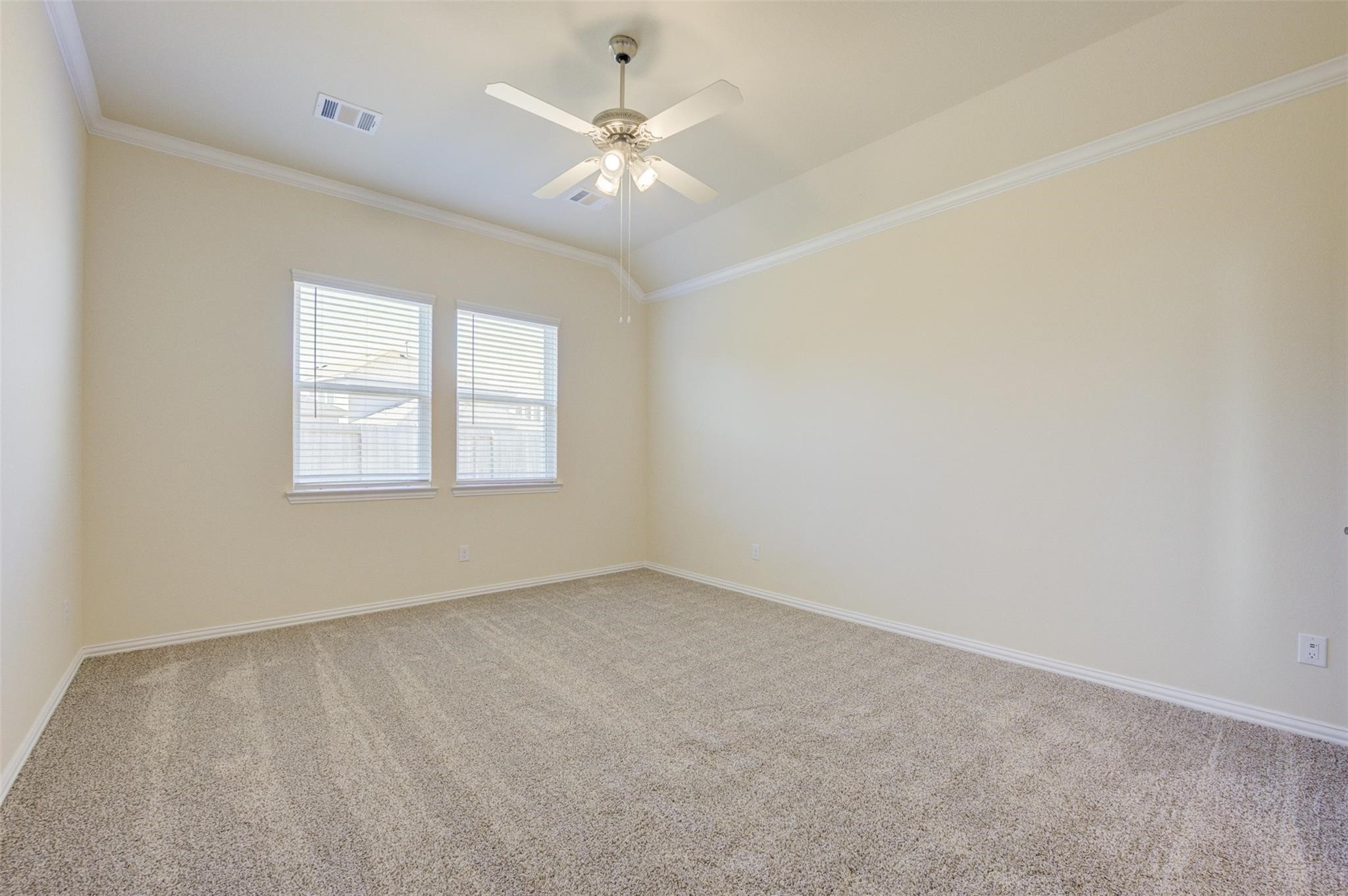 10902 Granite Chief Drive Rosharon, TX 77583 - Photo 22 of 32 an empty room with windows and fan