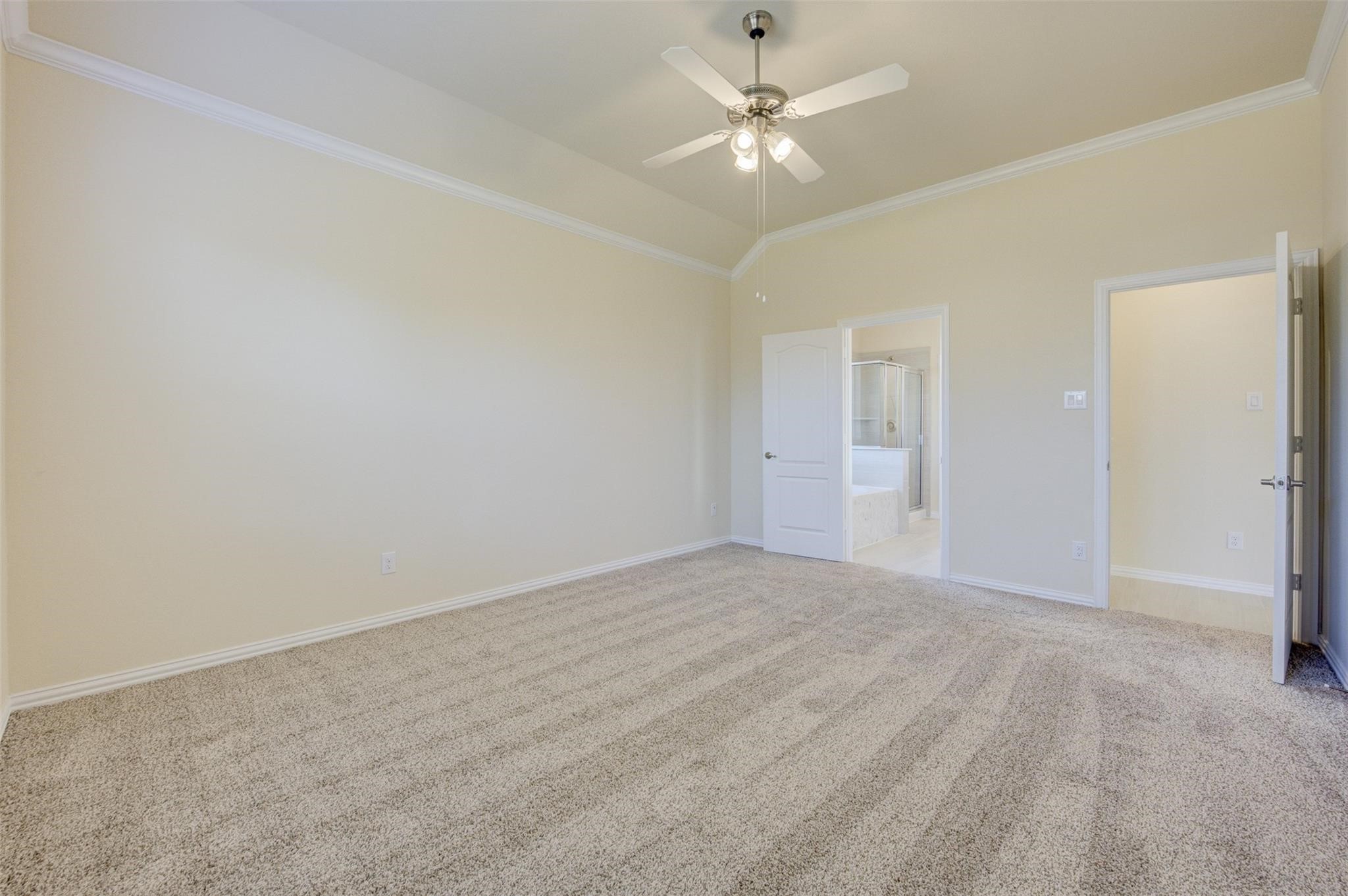 10902 Granite Chief Drive Rosharon, TX 77583 - Photo 23 of 32 an empty room with a chandelier fan and windows