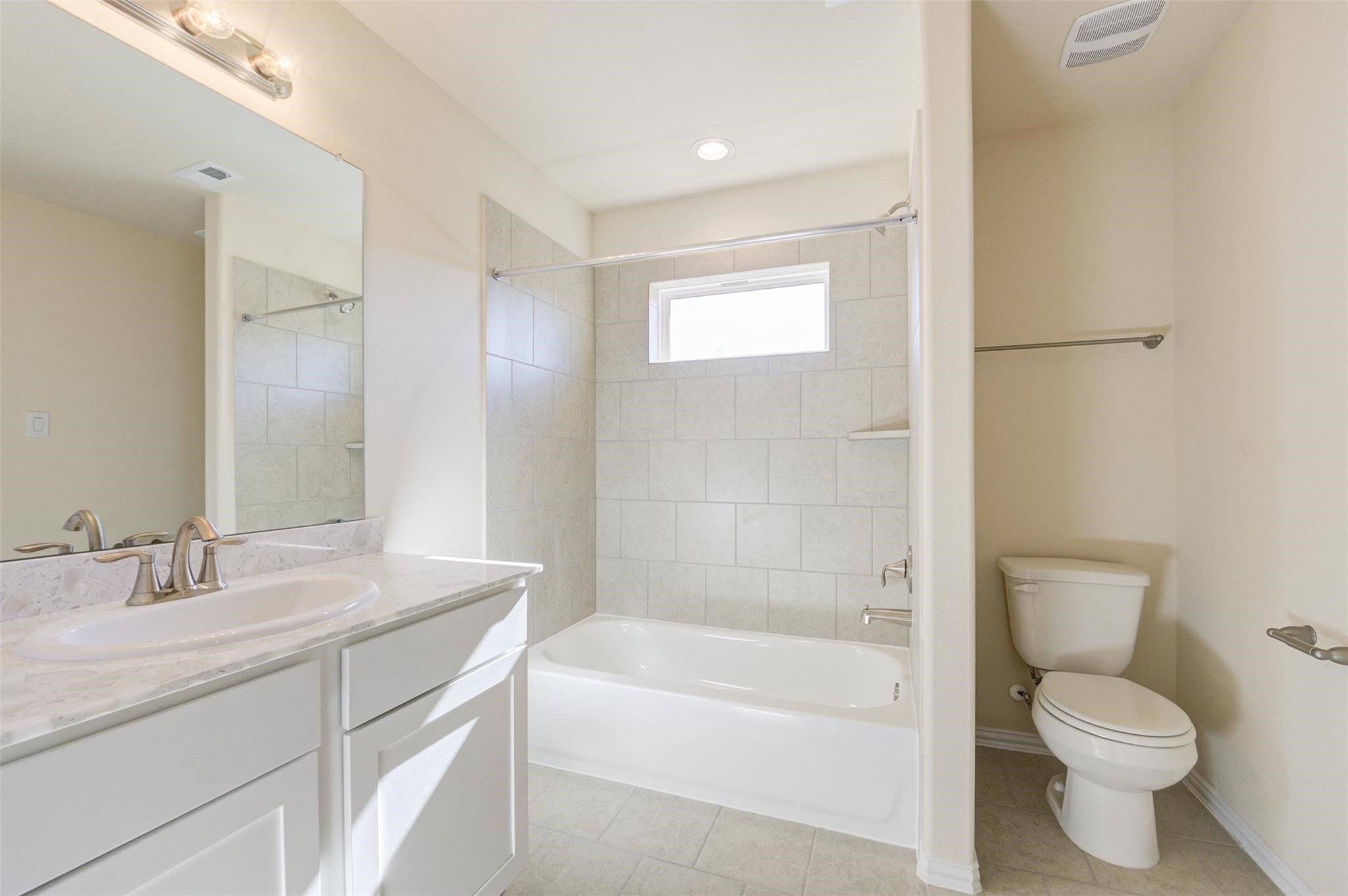10902 Granite Chief Drive Rosharon, TX 77583 - Photo 25 of 32 a bathroom with a granite countertop toilet a sink and bathtub